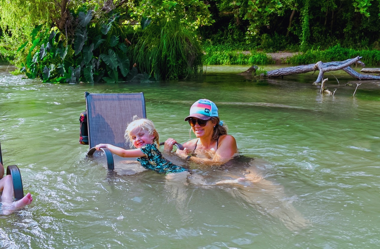 Mom and child in the river