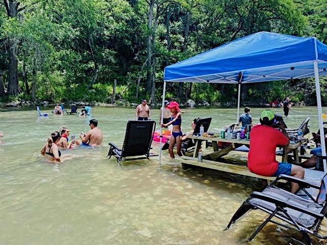 Guests enjoying the river picnic deck