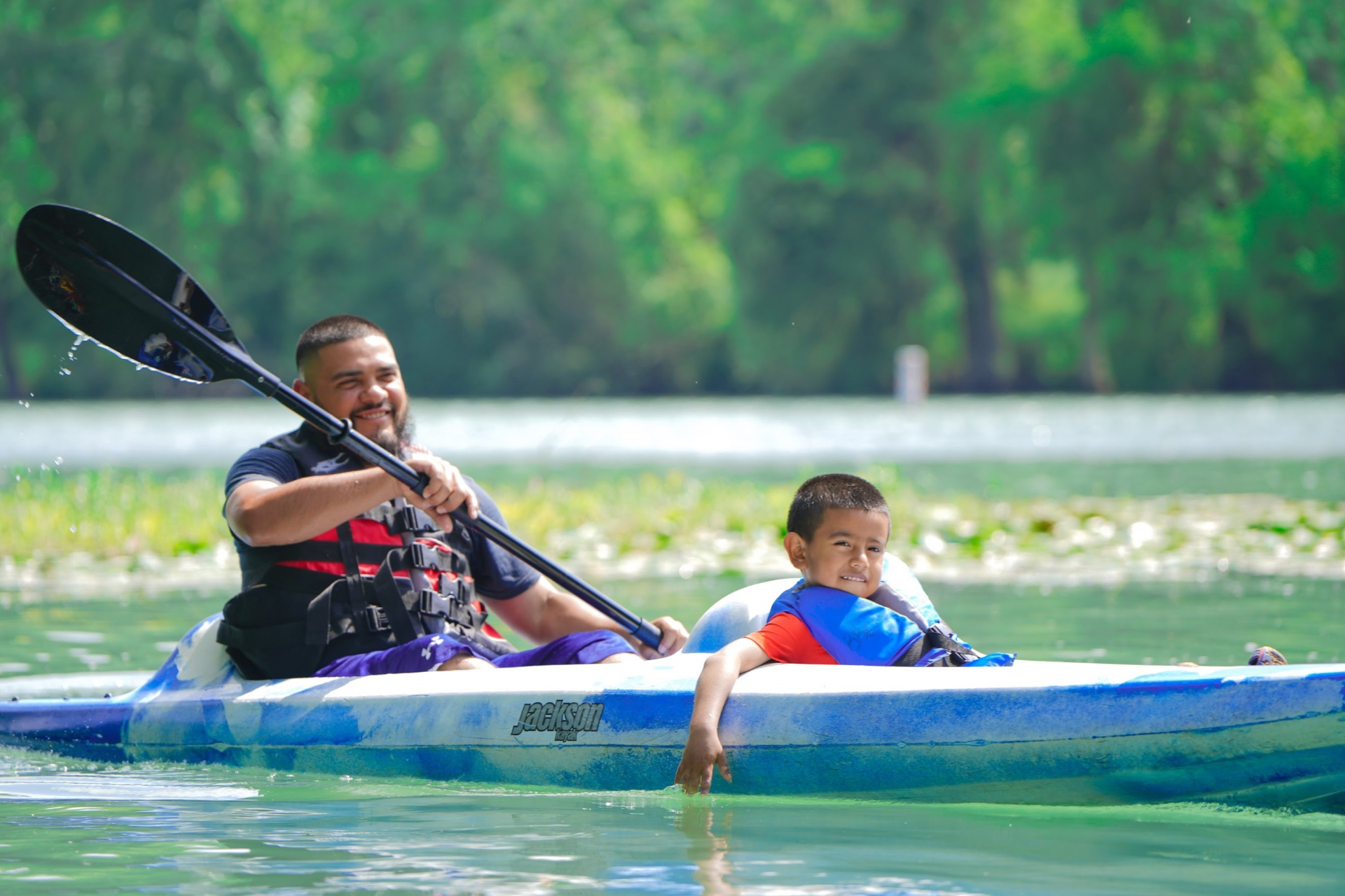 Dad and son kayaking